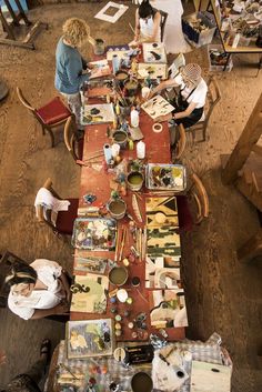 an overhead view of people sitting at a long table