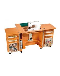 a sewing machine sitting on top of a wooden table next to a shelf filled with crafting supplies