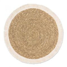 a round rug with fringes on the bottom in beige and white colors, against a white background