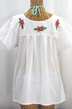 "The \"La Mariposa Libre\" Mexican Blouse by Siren: * Ornate hand embroidery with open sleeves, available here in WHITE with MULTI-COLORED embroidery. * Dyed, distressed and embroidered entirely by hand for an authentic, retro-vintage and hippie casual vibe. * Light, gauzy and semi-sheer 100% cotton throughout; wear it billowy and flowing in the traditional bohemian style. * Our ornate butterly floral embroidery patterns are a faithful tribute to the original Mexican style hippie blouses of the White Folk Style Embroidered Top With Resham Embroidery, White Folk Style Top With Resham Embroidery, White Traditional Peasant Top With Floral Embroidery, Traditional White Peasant Top With Floral Embroidery, Traditional White Peasant Top With Embroidered Neckline, White Folk Blouse With Resham Embroidery, White Short Sleeve Blouse With Embroidered Sleeves, White Blouse With Embroidered Short Sleeves, White Embroidered Short Sleeve Blouse