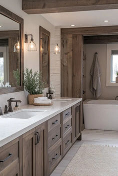 Showcasing transitional bathroom design, this rustic bathroom softens reclaimed wood with sleek stone surfaces. Contemporary fixtures give the rustic aesthetic a modern update. Ideal for refined, earthy appeal. Click here for rustic modern bathroom tips. Dark Stained Wood Bathroom Vanity, Knotty Alder Bathroom Cabinets Master Bath, Rustic Master Bath Vanity, 2 Sink Wood Bathroom Vanity, Rustic Farmhouse Vanity Bathroom, Barndominium Master Bath Ideas, Modern Western Bathroom Ideas, Western Master Bath Ideas, Rustic Hickory Bathroom Vanity