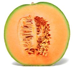 a cut in half melon with seeds inside