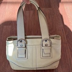 Nwt Beige Leather (Soft Milled Cowhide) Coach Purse With 1 Outer Pocket With Magnetic Closure. The Interior Of Bag Has A Zipper Pocket And Two Other Small Pockets. Silver Buckle Details On Straps. Width: 13” Height: 9” Depth: 4” No Holes/Stains. Comes From A Smoke Free Home Cream Shoulder Bag With Palladium Hardware For Office, Coach Beige Shoulder Bag With Silver-tone Hardware, Modern Cream Shoulder Bag With Silver-tone Hardware, Classic Silver Satchel Shoulder Bag, Silver Leather Shoulder Bag For Office, Cream Tote Shoulder Bag With Palladium Hardware, Classic Cream Shoulder Bag With Silver-tone Hardware, Cream Shoulder Bag With Silver-tone Hardware For Shopping, Classic Silver Shoulder Bag With Handles