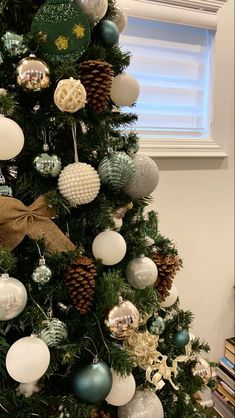 a decorated christmas tree with ornaments on it