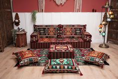 a living room filled with lots of furniture and rugs