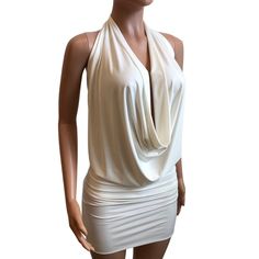 White Backless Halter Top For Evening, White V-neck Backless Dress For Night Out, White Halter Neck Dress For Night Out, White Backless Halter Top For Night Out, White Backless Top For Evening, Elegant White Halter Top For Date Night, White Backless Top For Night Out, White Fitted Dress With Cowl Back, Fitted Halter Top With Cowl Back For Night Out