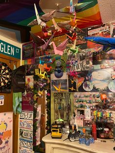 a room filled with lots of assorted items and signs hanging from the ceiling above it