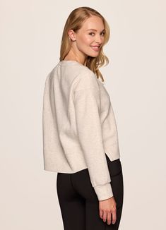 Our In The Studio Cropped Pullover combines a classic crewneck design and super soft, trendy scuba fabric for a lightweight pullover you can take from studio to street. A slightly cropped length is complemented by a relaxed fit, dropped shoulders and sporty seaming detail that allow for easy styling and layering. Throw this cute crop sweatshirt over a sports bra for a workout or pair it with jeans for a casual-cute look. Versatile Crew Neck Tops With Ribbed Cuffs, Trendy Crew Neck Sweatshirt With Soft Texture, Relaxed Fit Cropped Sweater For Layering, Spring Cropped Crew Neck Sweater, Crew Neck Relaxed Fit Cropped Sweater In Athleisure Style, Casual Cropped Long Sleeve Sweater With Ribbed Waistband, Comfortable Crew Neck Sweatshirt, Casual Long Sleeve Cropped Sweater With Ribbed Waistband, Versatile Long Sleeve Sweatshirt With Ribbed Cuffs