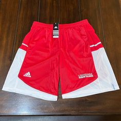 Brand New With Tags, Rare, 2012, Adidas “Louisiana Ragin Cajuns” Red/White “Mvp” Climalite Performance Basketball Shorts In Size Mens Large. As Always 100% Authentic Adidas Goods From A Trusted Poshmark Ambassador. 100% Performance Polyester. These Shorts Do Have The Front 2 Pockets. Very Rare And Hard To Find Shorts. Retail: $45.00 Thank You For Visiting My Closet!! White Adidas Training Shorts, Adidas White Athletic Shorts With Moisture-wicking, Adidas Red Athletic Shorts For Sports, Red Three Stripes Activewear For Sports, Adidas Red Training Bottoms, Red Adidas Training Bottoms, Red Adidas Training Activewear, Red Adidas Activewear For Training, Red Adidas Activewear For Sports