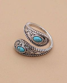 A romantic statement piece to bring out your inner bohemian, there’s plenty for your eyes to feast on in this exquisite ring. Set with two smooth turquoise ovals, its sterling band is textured with fauna reliefs and roped edges while the wrapped band can be slightly adjusted for optimum fit and comfort. Sterling silver filigree wrap ring Features two inlays of reconstituted turquoise Inlays are each measures 3mm x 5mm Slightly adjustable design Available in ring sizes 6-9 Made in Thailand Due to Wrap Ring, Sterling Silver Filigree, Ring Sizes, Wrap Rings, Silver Filigree, Gemstone Bracelets, A Romantic, Gemstone Necklace, Gemstone Pendant