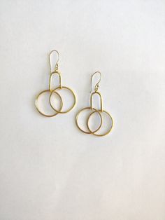 These Handmade Gold Minimal Earrings scream PRETTY all the way! Say more with less is what minimalism is - Get these beautiful Geometric Minimal Dangle & Drop earrings and speak more style and vogue. The earrings can go with everything and you can hop them on in your daily routine. they will work great as office accessories, party earrings as well as gifts :) Specifications: Brass Handmade Gold Plated Minimal earrings Geometric Style Hypoallergenic (suits all skin types) Nickel & Lead-free Handmade Metal Earrings For Everyday Use, Everyday Metal Earrings, Nickel-free Hoop Earrings For Everyday, Nickel Free Hoop Earrings For Everyday, Nickel-free Drop Wrap Earrings For Everyday, Nickel-free Drop Wrap Earrings, Everyday Dangle Hoop Earrings For Pierced Ears, Everyday Dangle Hoop Earrings, Everyday Nickel-free Drop Wrap Earrings