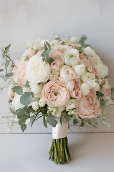 a bridal bouquet with pink and white flowers