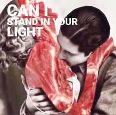 a man holding a large piece of meat in his hands with the caption can it stand in your light?