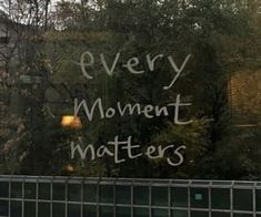 a sign that says every movement matters on the side of a building with trees in the background