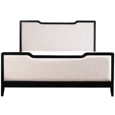 an upholstered bed frame with black and white trim on the headboard, in front of a white background