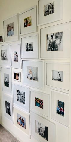 a white wall with many pictures on it