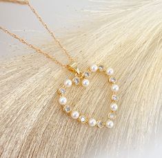 "Pearl heart necklace MATERIAL AND SIZE 18k Gold plated Heart Pearls and cubic zirconia Heart size: 2.5cm Chain length: 45cm or 18\" If you have questions about the product, feel free to reach me out. Don't forget to check out my other items in the store: Https://www.etsy.com/shop/nyahwithlove" Pearl Heart Necklace, Coquette Jewelry, Mom Love, Gift Valentines Day, Pendant Heart, Necklace Love, Catholic Jewelry, Pearl Heart, Love Jewelry