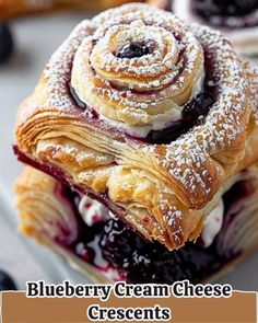 blueberry cream cheese crescent pastries stacked on top of each other