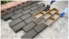 a brick patio being built with tools and bricks