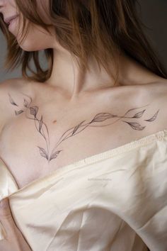 a woman with a tattoo on her chest