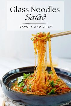 glass noodles salad in a black bowl with chopsticks on top and text overlay that reads, glass noodles salad savory and spicy