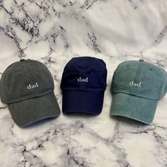 These are not cheap hats! These hats have thick, garment dyed fabric and leather buckles with quality embroidery. Each hat is custom made with your selections in Memphis by me. If you have a request for a design or want a different saying on the hat or would like the "dad" bigger or smaller, please send me a message and we can get started on a custom order! >> Hat Details << ■100% garment-washed cotton  ■Leather strap with antiqued brass buckle ■6-panel, unstructured, low-profile ■Tuck-away leather back strap ■Cool-Crown™ mesh lining >> Pictured is the charcoal hat with white thread color << Adjustable Dad Hat Baseball Cap For Father's Day, Adjustable Dad Hat For Father's Day, Adjustable Flat Bill Dad Hat For Father's Day, Personalized Curved Brim Baseball Cap For Father's Day, Adjustable Curved Brim Hat For Father's Day, Casual Curved Bill Baseball Cap For Father's Day, Father's Day Casual Baseball Cap With Curved Bill, Casual Flat Bill Hat Gift, Father's Day Hats With Letter Print