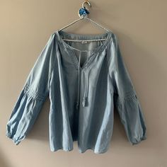 "Casual and modern light blue Tencel Chambray peasant poet/artist shirt, Comfortable ,Loose fitting, slip on style, Puffy sleeves with Elastic cuffs. Wide neck with a tie. Eco-Friendly tencel! Tag: size 3X Measurements: bust: 54\" length: approx. 30\" Material: 100% Tencel Condition: very nice, washed and ready to wear and enjoy! Brand: DEX" Artist Shirts, Smock Blouse, Puffy Sleeves, Peasant Blouse, Boho Bohemian, Bohemian Chic, Plus Size Blouses, Plus Size Casual, Summer Shirts