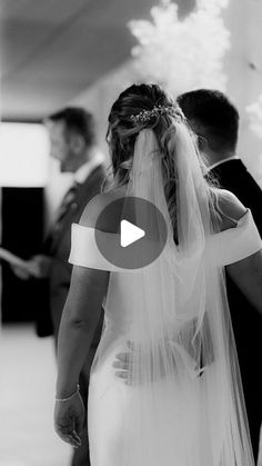 a bride and groom walking down the aisle