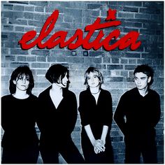 three people standing in front of a brick wall with the word elastica on it