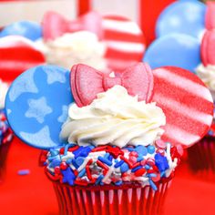 red white and blue cupcakes with mickey mouse ears on them are ready to be eaten