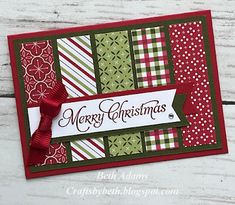 a christmas card with red, green and white striped papers on it that says merry christmas