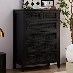 a black chest of drawers in a living room