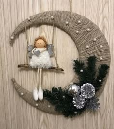 a christmas wreath with an angel on it