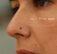 a ladybug on the nose of a woman's nose is not fire opal