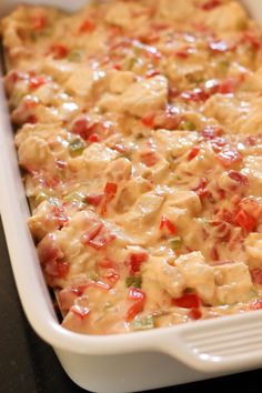 a casserole dish with cheese and vegetables in it