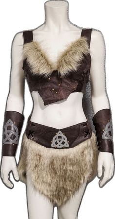 a female mannequin wearing a brown outfit with fur collar and cuffs on it's chest