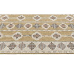 a beige and brown area rug with an ornate design on the bottom, in front of a white background