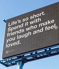 a billboard with a quote on it that says life's so short spend it with friends who make you laugh and feel loved