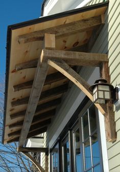 an outside view of a house with a wooden porch