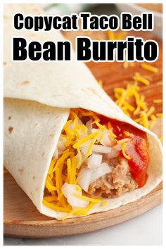 a burrito with meat and cheese on it