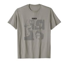 a grey t - shirt with the faces of two men and one woman on it