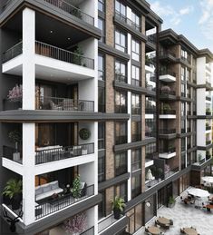 an apartment building with balconies on the second floor