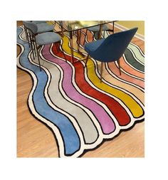 a colorful rug is on the floor with chairs