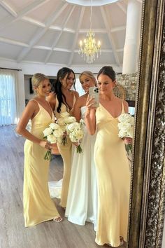 the bridesmaids are all dressed in yellow dresses