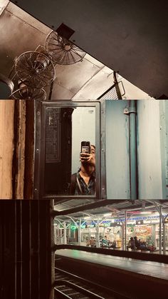 a man taking a selfie in front of a mirror with an old fan hanging from the ceiling