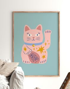 a pink cat with gold stars on it's chest sitting in front of a blue background