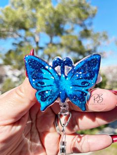 Beautiful Galaxy Butterfly Badge Clip is the perfect gift to accessories your scrubs or uniform.  Details: ~ 2" acrylic blank  ~ Front: Hand glitter, permanent vinyl and sealed with resin for extra protection ~ Back: Velcro for easy removal and strong enough to hold ~ Badge clip: Alligator swivel clip or Belt clip available Attachment options: ~ Permanently: Face topper will be permanently adhered to the reel  ~ Interchangeable: Face topper and reel will be secured with dual lock Velcro ~ FACE O Cheap Customizable Blue Badge Reel, Galaxy Butterfly, Beautiful Galaxy, Front Hand, Personal Hygiene, Belt Clip, Permanent Vinyl, Badge Holders Lanyard, Badge Reel