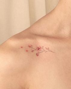 a woman's chest with small flowers on it