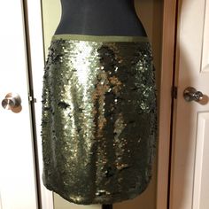 A Matte Sequin Shift Skirt. No Stretch, Hidden Side Zipper With Hook And Eye Closure. Olive Grosgrain Waist Detailing. Fully Lined. 18” From Waist To Hem. Fun To Dress Up Or Dress Down. It's Not Just For Holidays But Great For The Holidays! Arbor Day - Festivus _ Thanksgiving - Christmas - New Year - Elegant Green Skirt With Sequins, Elegant Green Sequined Skirt, Sequined Skirt, Arbor Day, Arbour Day, Skirt Zipper, Hook And Eye, Hook Eye, Thanksgiving Christmas