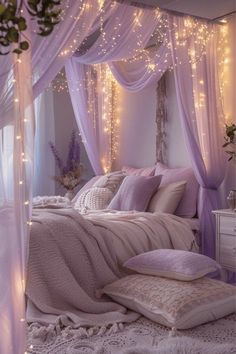 a bed with lights on the headboard and canopy over it in a room filled with furniture